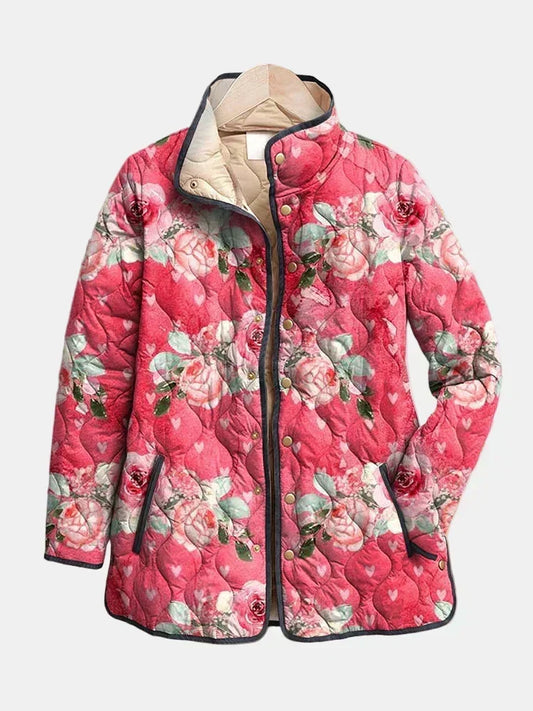 Cordelia quilted jacket shown flat: painted roses on raspberry pink, dark gray piping and gold-tone snap front