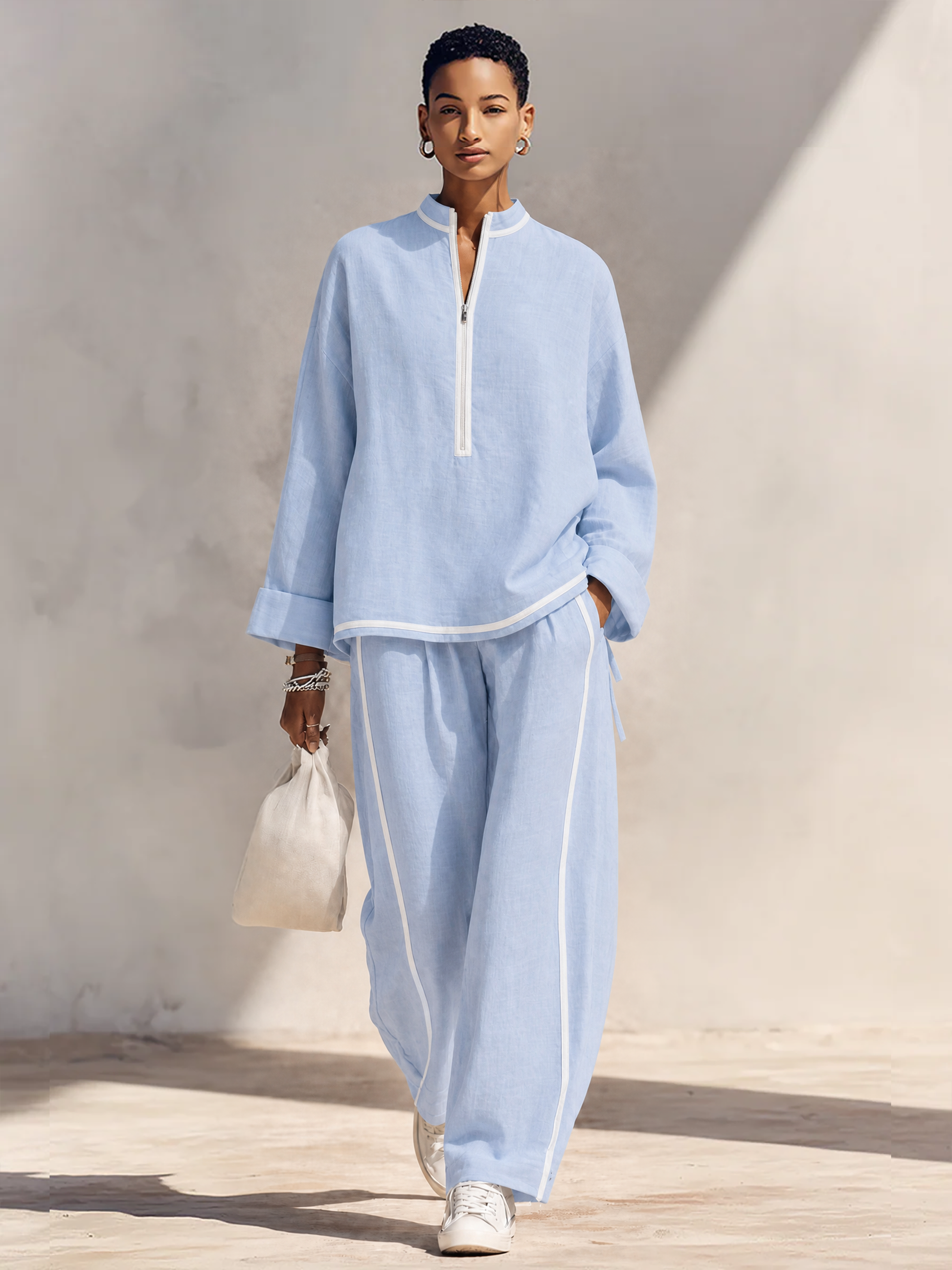 Light blue linen set, front view of the oversized half-zip top and wide-leg pants