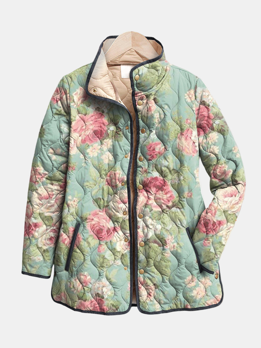 Rosemary quilted jacket shown flat: large vintage roses on muted sage green with dark piping and stand collar