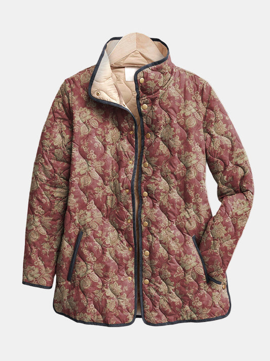 Augustine quilted jacket shown flat: muted gold damask scrollwork on plum rose, dark piping and gold-tone snap front