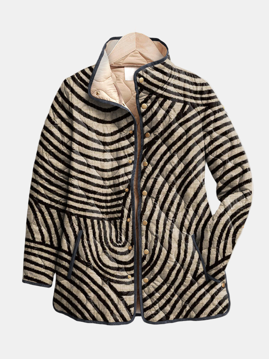 Harriet quilted jacket shown flat: hand-drawn black circles on linen beige with a gold-tone snap front and stand collar