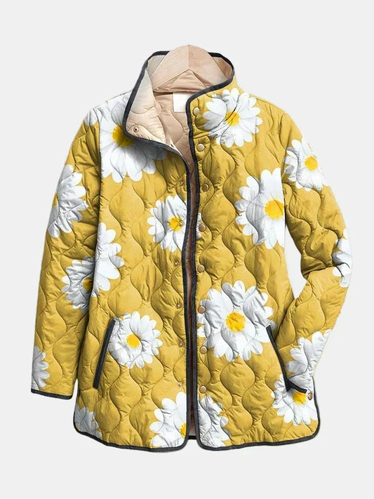 Clementine quilted jacket shown flat: large white daisies on muted mustard, gold-tone snap front and stand collar