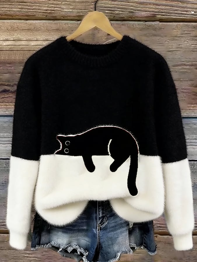 Bonnie cat print oversized sweater in black, showing the sleeping cat across the color block front