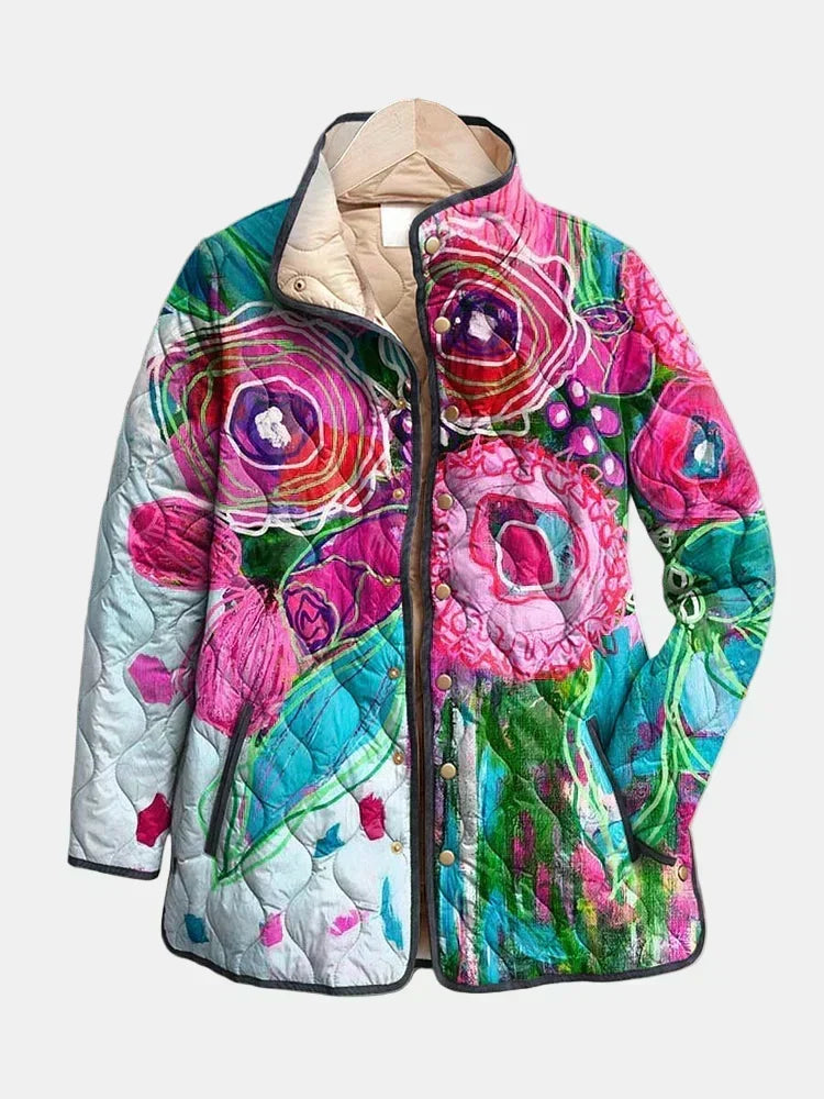 Lavinia quilted jacket shown flat: blended watercolor flowers in fuchsia, turquoise and aqua with charcoal piping