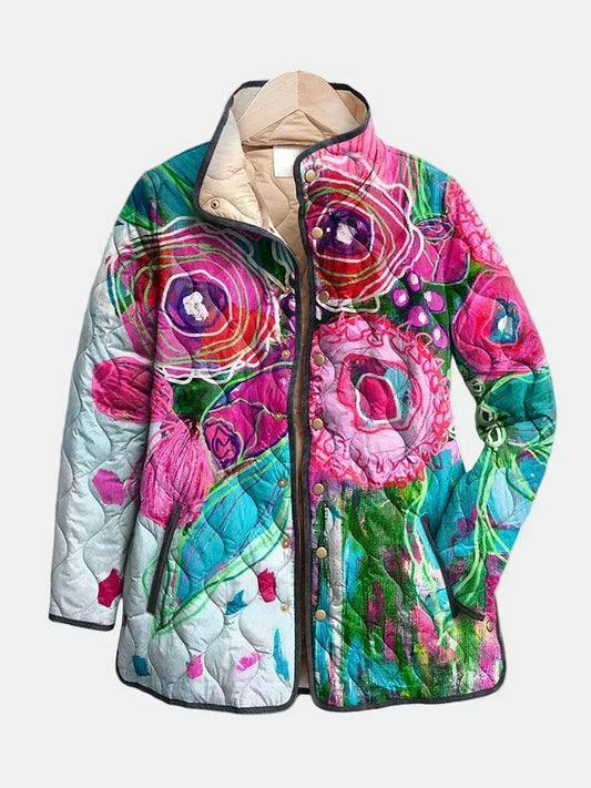 Lavinia quilted jacket shown flat: blended watercolor flowers in fuchsia, turquoise and aqua with charcoal piping