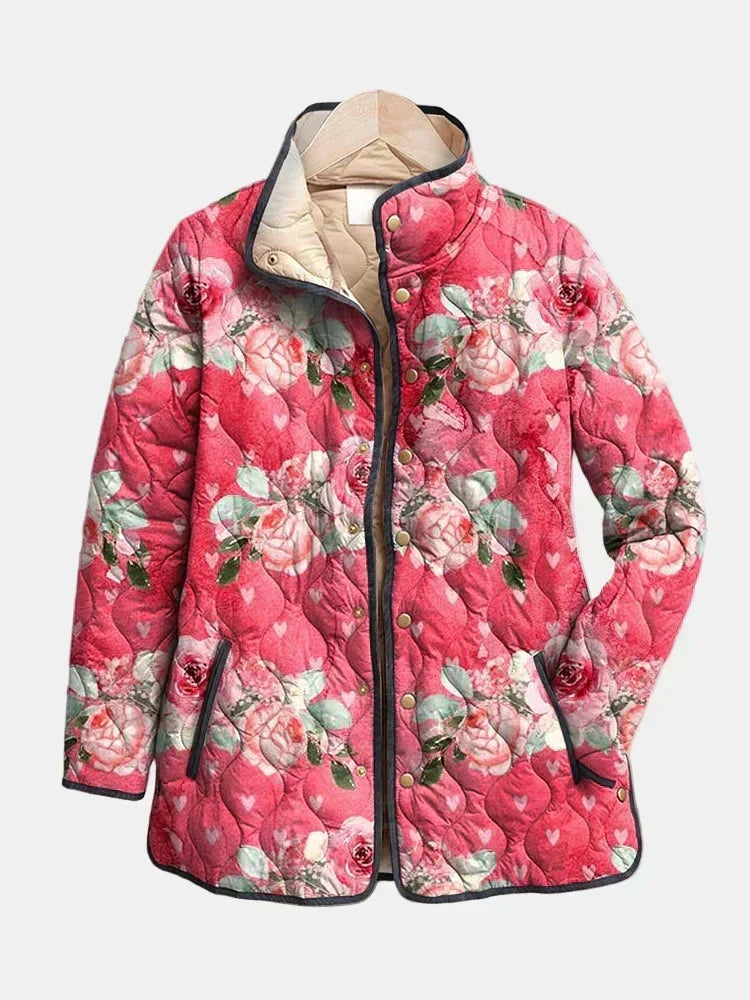 Cordelia quilted jacket shown flat: painted roses on raspberry pink, dark gray piping and gold-tone snap front