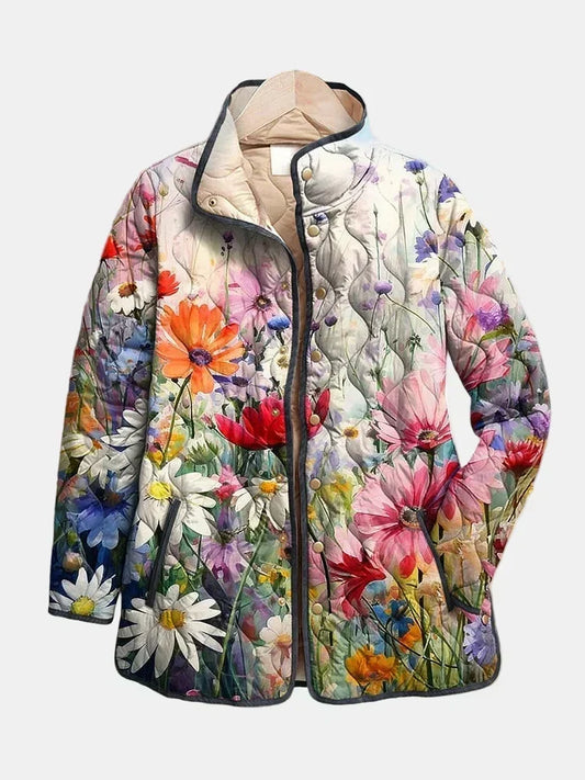 Emmeline quilted jacket shown flat: multicolored wildflowers on cream, gold-tone snap front, stand collar with cream lining and dark piping