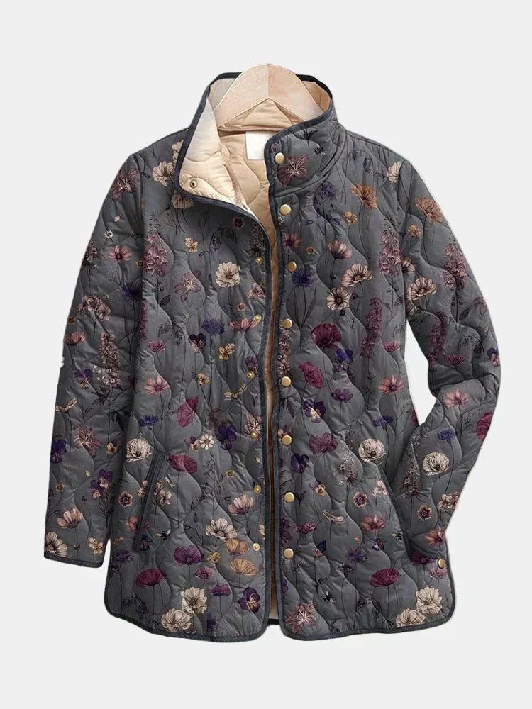 Dorothea quilted jacket shown flat: mauve and plum dried flowers on warm gray with a gold-tone snap front
