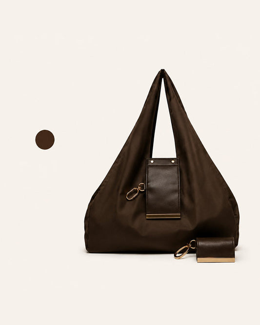 Varelli vegan leather tote bag shown folded as a charm and fully opened