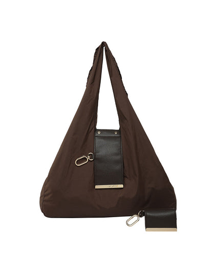 Woman carrying the Varelli vegan leather tote bag over her shoulder