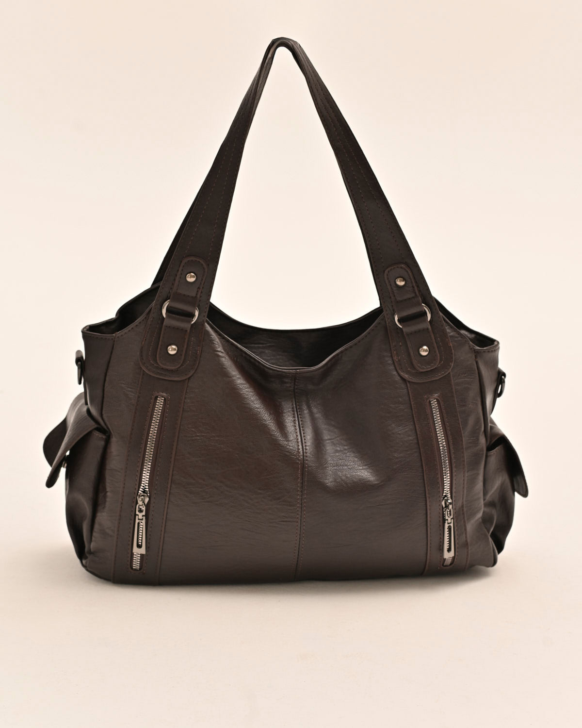 Side view of the Edyisa brown vegan leather shoulder bag