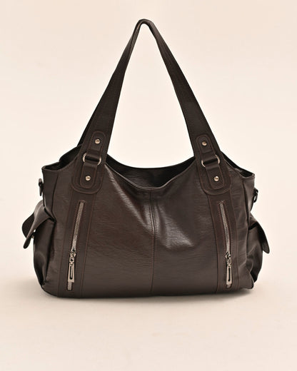 Side view of the Edyisa brown vegan leather shoulder bag