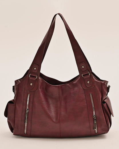 Side view of the Edyisa burgundy vegan leather shoulder bag