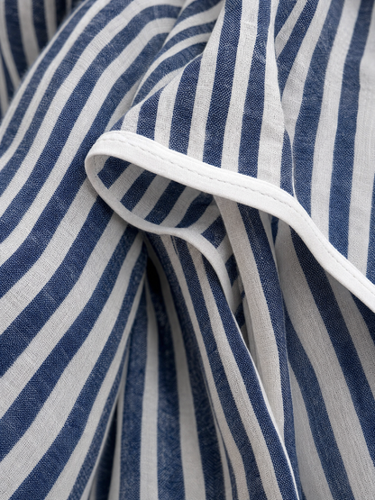 Close-up of the navy and white striped linen fabric with white piping