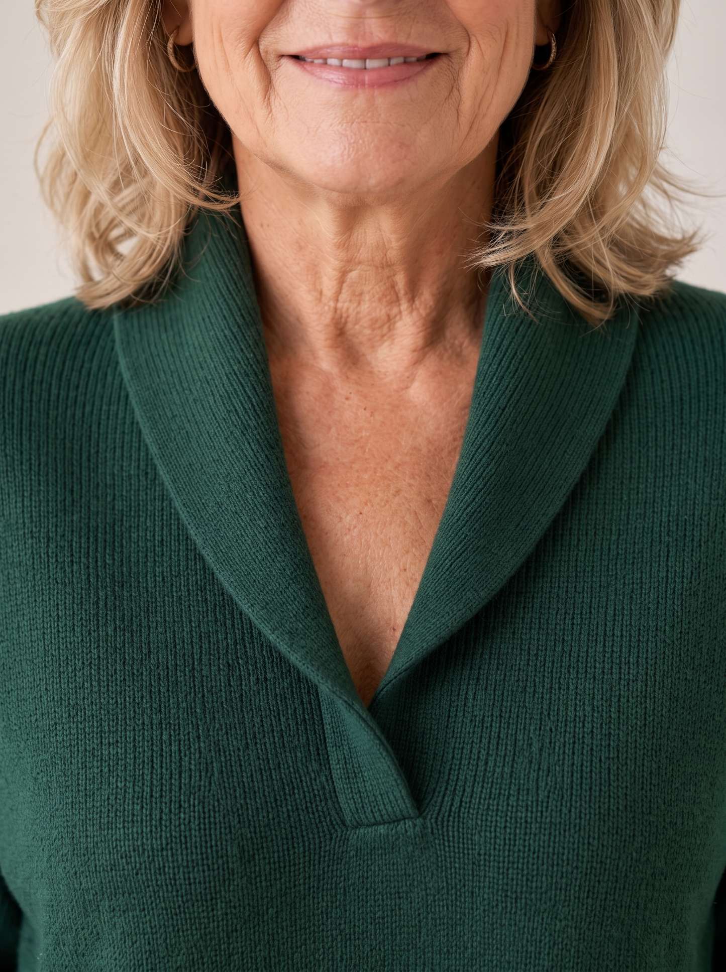 Close view of the ribbed shawl collar and soft knit texture on the Greta sweater