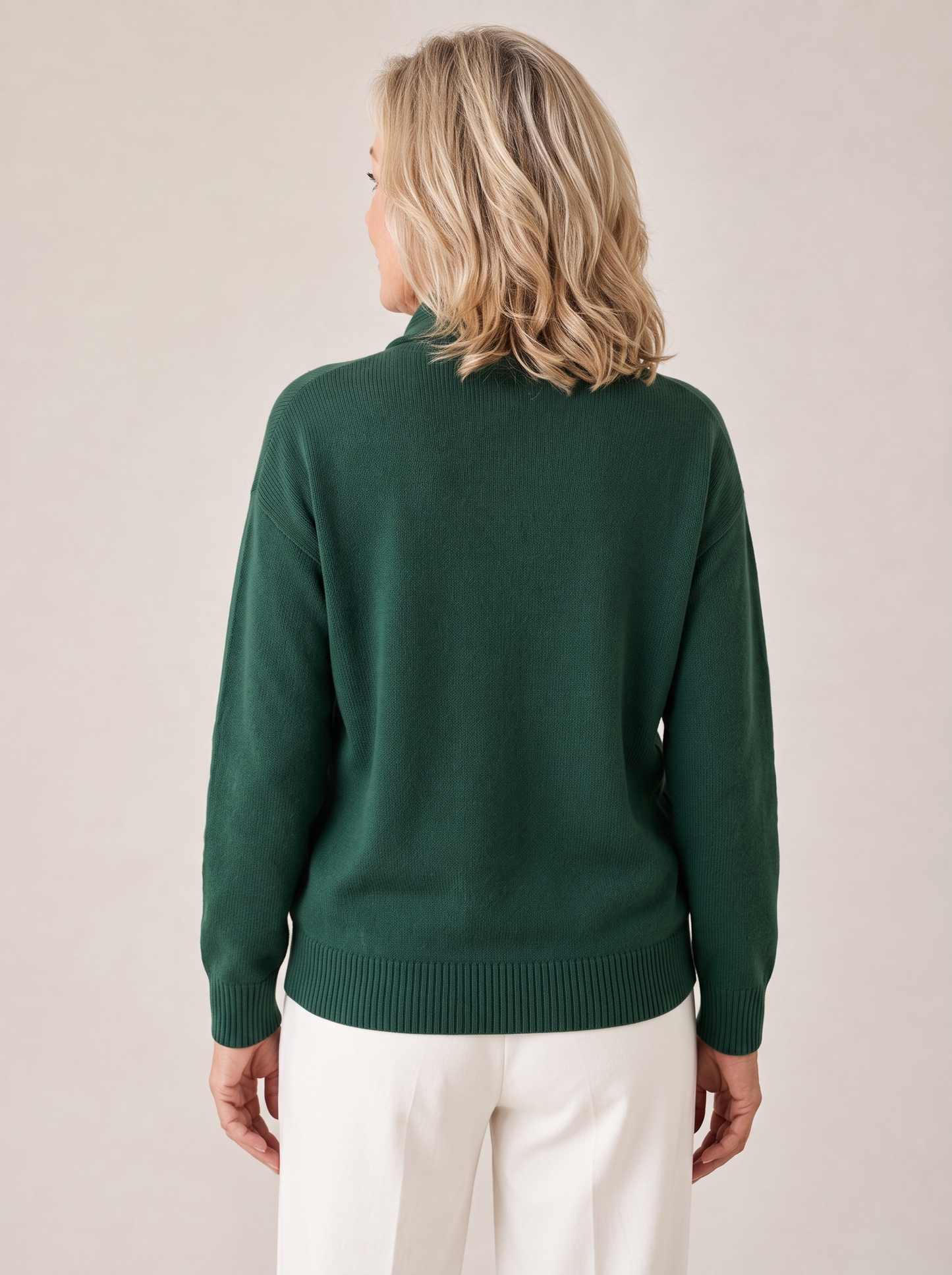 Woman wearing the Greta shawl collar sweater, showing the ribbed cuffs and hem